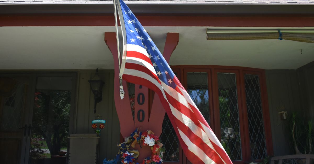 Why a Wall-Mounted Flagpole Is a Great Space-Saving Option - Liberty Flagpoles